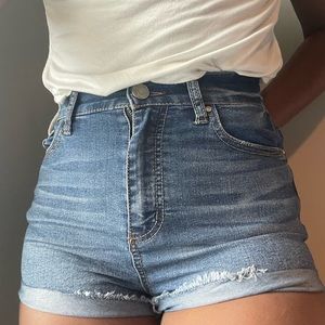 Medium wash denim(type) shorts. Stretchy jean material. VERY COMFORTABLE size 0